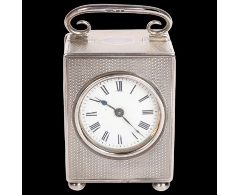A George V silver carriage clock, Goldsmiths & Silversmiths Co Ltd, London 1918, rectangular form with allover engine turned 