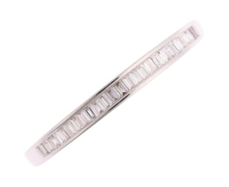 An 18ct white gold diamond half eternity ring, by Stubbs & Co, channel set with baguette-cut diamonds, total diamond content 