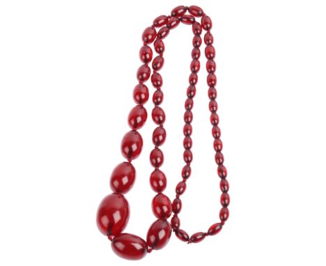 A single-strand graduated cherry amber bead necklace, beads measure: 34.4-12.4mm, 90cm, 85.9g Condition Report:All beads pres