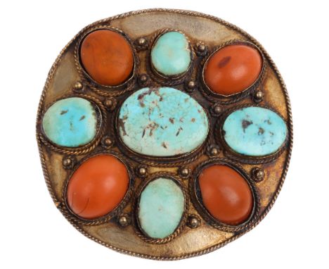 A large Tibetan turquoise and coral panel brooch, unmarked gilt-metal settings, 58.6mm, 27.5g Condition Report:A few small ed