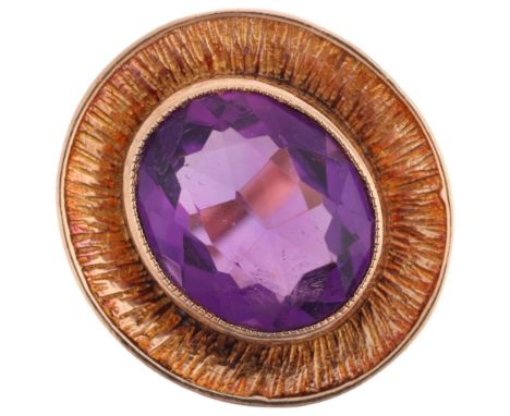 A 1970s 9ct gold amethyst dress ring, maker CG&S, Birmingham 1974, panel rub-over set with oval mixed-cut amethyst within tex