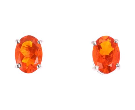 A pair of 9ct white gold fire opal earrings, each claw set with 0.5ct oval mixed-cut fire opal, with stud fittings, opals mea