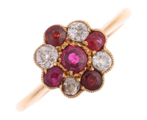 An 18ct gold ruby and diamond cruciform cluster ring, set with old-cut diamonds, total diamond content approx 0.25ct, setting