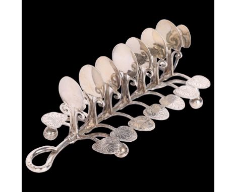 A Victorian silver naturalistic 8-bar toast rack, Aston & Son, Birmingham 1858, leaf petal and tendril form, on bun feet, wit