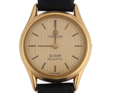 OMEGA - a lady's gold plated stainless steel De Ville quartz wristwatch, ref. 1365, engine turned champagne dial with applied