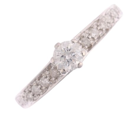 A 9ct white gold 0.25ct solitaire diamond ring, claw set with modern round brilliant-cut diamond and single-cut diamond shoul