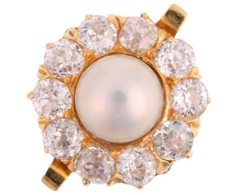 An impressive 18ct gold whole button pearl and diamond flowerhead cluster ring, set with 6.9mm pearl surrounded by old Europe
