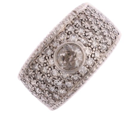 A large 18ct white gold diamond band ring, maker ZJ, import London 1978, rub-over and pave set with round-cut diamonds, total