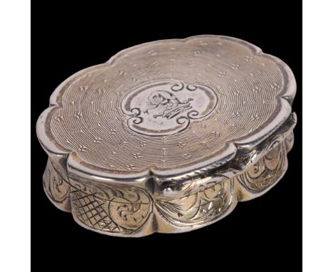 A Victorian silver vinaigrette, Edward Smith, Birmingham 1853, oval scalloped form with engine turned decoration and engraved