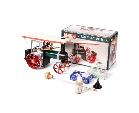 Boxed Mamod TE1A Steam Tractor, with funnel, tablets and other parts.  In very good and clean condition, showing minimal sign