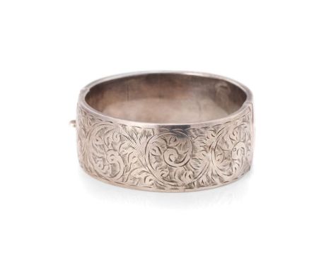 Vintage silver bangle with hand chased repeated design. Weight 35.1 grams.  