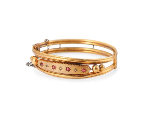 Garnet and Diamond set gold plated Victorian bangle. Four garnets set with three diamonds, safety chain.  