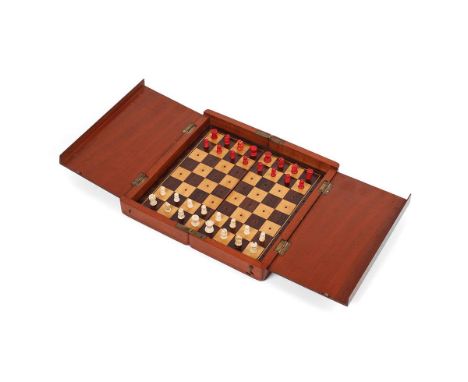 Mahogany cased travel chess set with bone pieces. Case is hinged and folds for transportation.  
