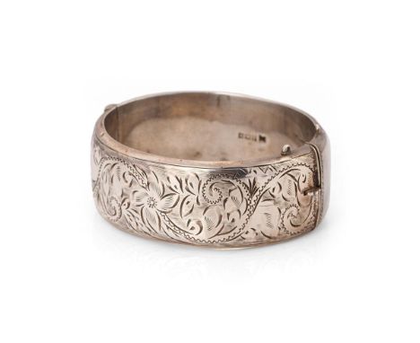 Vintage silver bangle with hand chased repeated design. Weight 40 grams.  