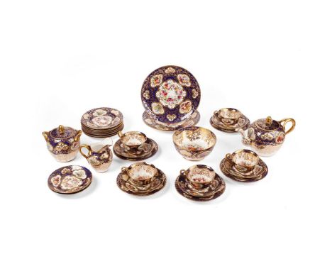 Spode Copeland tea service, circa 1890, hand painted porcelain, with raised jewel work with floral vignettes on a cobalt and 