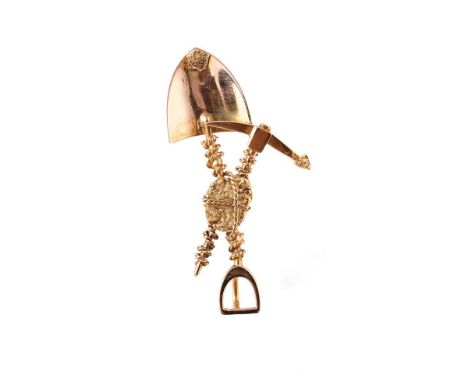 9ct gold pendant, in the form of a miner's tools such as a spade and a pick axe, 3.9g, 47mm wide, tests as 9ct or better.