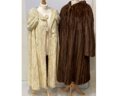 A 3/4 length brown fur coat, labelled VLADIMIR OLISSOFF Condition: sign of wear and a split on shoulders to fur, wear and spl
