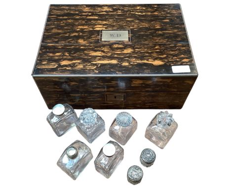 A brass bound and Coromandel wood stationery box, with fitted interior, and a quantity of old glass travelling bottles with w