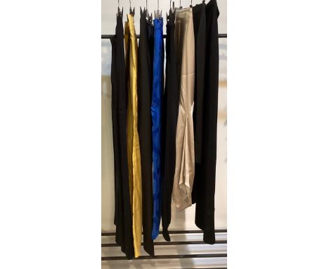 A quantity of trousers and skirts to include ISABEL MARANT yellow parachute trousers and blue woven pattern trousers. DONNA K