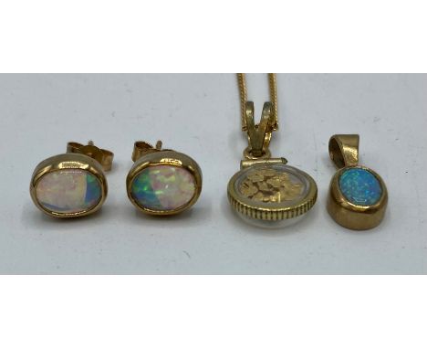 A set of 9ct gold mounted black opal pendant and earring set, together with a yellow metal pendant and chain.