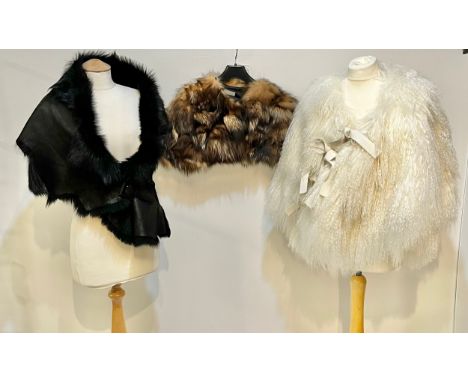 A goat hair style cream wrap cape, EMPORIO ARMANI short fur stole, KARL DONOGHUE black leather and fur stole, with black buck