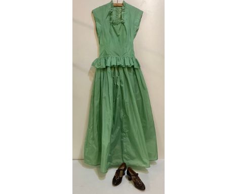 A long green dress made from parachute fabric, during the WW2, and worn by the vendors' grandmother, and a pair of vintage sh