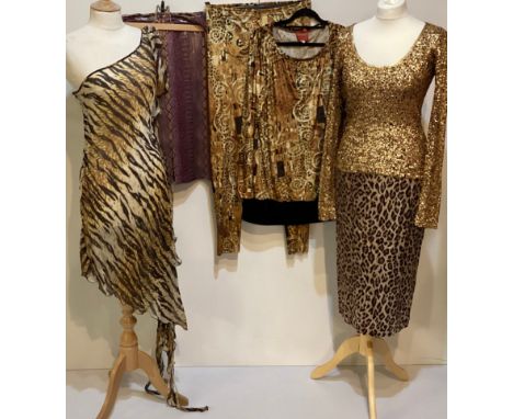 A quantity of clothes to include A DONNA KAREN gold sequin and black top, a DOLCE &amp; GABBANA animal print long top and ski
