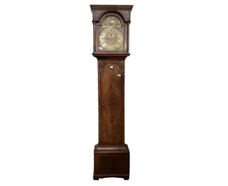 A Long case clock  mahogany and walnut veneered 8 day , by Christopher Tucker London, The arch brass and silvered dial with s