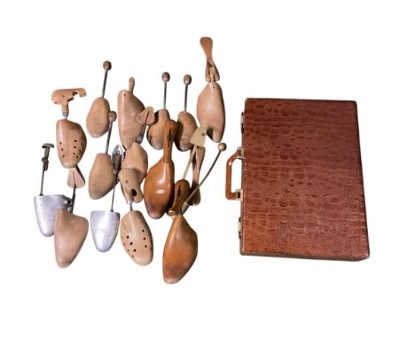 Quantity of vintage shoe trees and faux crocodile skin briefcase. 