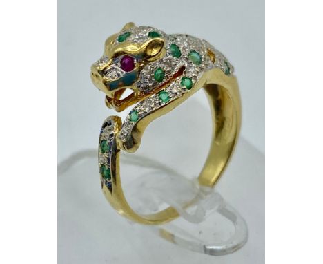 An 18ct Gold, ruby, emerald and diamond leopard ring in the Cartier style numbered 17249. Two vacant emerald settings. 5g