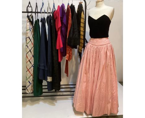 A quantity of later C20th clothes, no labels, some bespoke made, to include 6 long skirts, a pink suit, purple sleeveless top