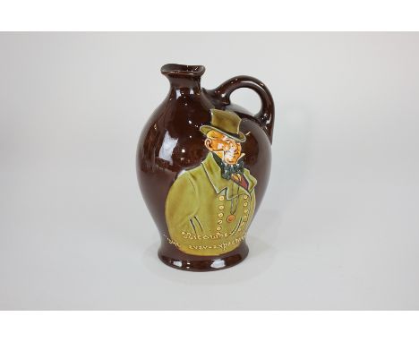 A Royal Doulton Dewars Whisky flask with Micawber 'The Ever-Expectant', 18cm high