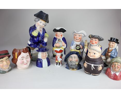 A large Toby jug dressed in a blue tunic, 37cm, together with two other Toby jugs and a small collection of various character