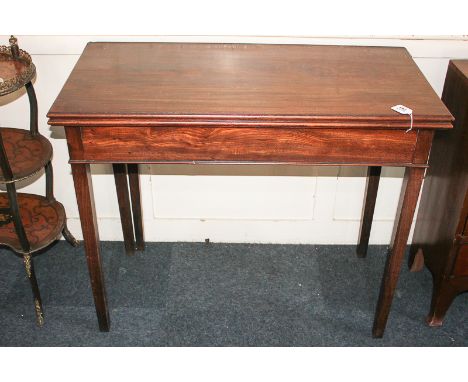 A Chippendale style mahogany tea table with fold-over rectangular top, on square tapered legs, 90cm