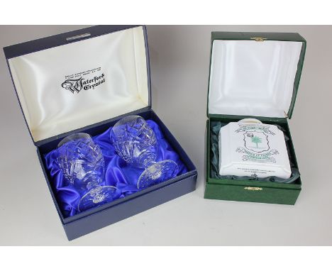 A cased pair of Waterford Crystal drinking glasses in presentation box, and a boxed china tea caddy with Assam Company 150 ye