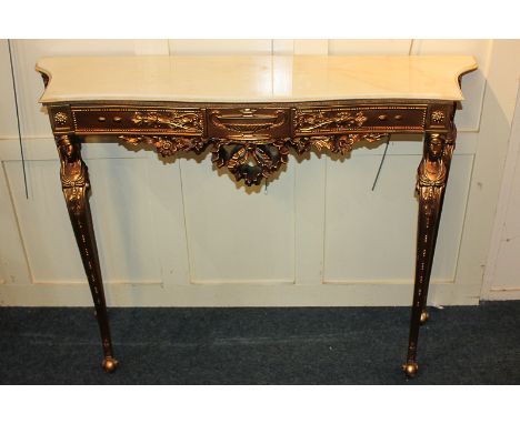 A Louis XI style gilt serpentine console table with marble top, on caryatid front supports and scroll feet, 118cm