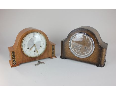 A 20th century Smiths mantel clock striking on a gong, in domed oak case, 23cm, together with a similar Smiths mantel clock, 