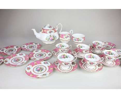 A Royal Albert 'Lady Carlyle' porcelain part tea set, with floral and scrolling pink and gilt decoration on white ground, com