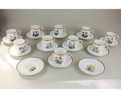 A set of ten Royal Worcester porcelain coffee cups and twelve saucers, decorated with individual flowers