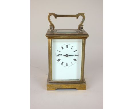 A brass and bevelled glass cased carriage clock, 14.5cm high
