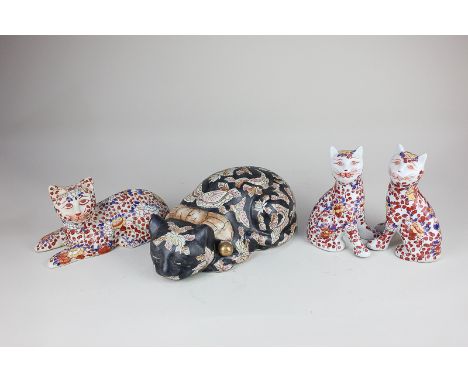 Three Japanese Imari style ceramic models of cats, tallest 16cm, together with a similar model of a sleeping cat, with floral