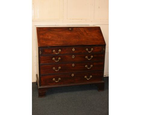 A George III mahogany bureau, with fall front enclosing fitted interior, with four graduated drawers, on bracket feet, 107cm