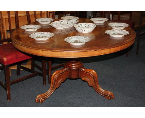 A Victorian mahogany breakfast table with circular tilt top, on baluster stem and tripod base with castors (a/f), 116cm