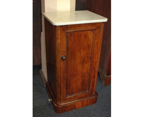 A Victorian walnut pot cupboard with marble shaped rectangular top and panel door enclosing shelf, on plinth base, 40cm