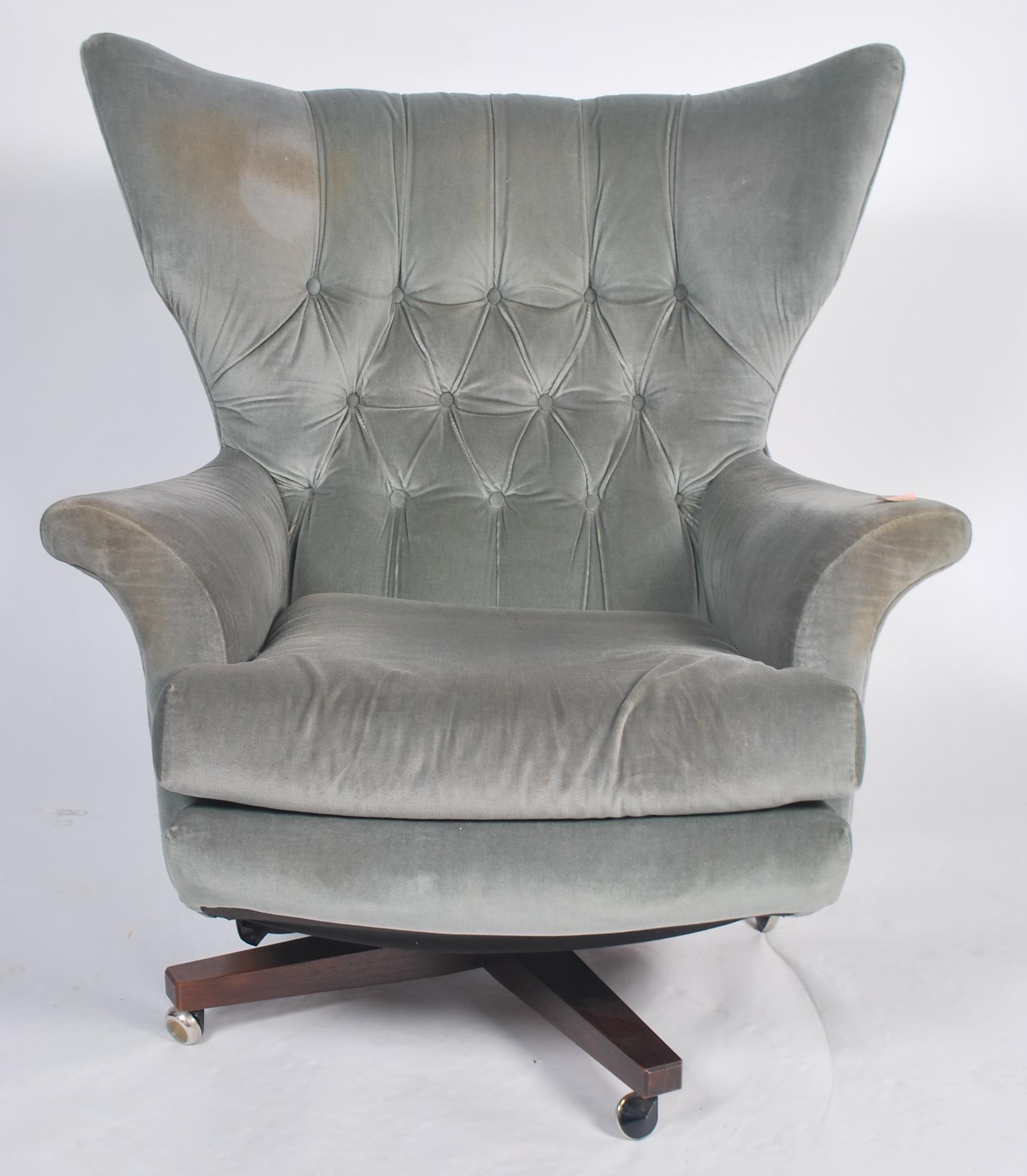 An original 1960's believed Parker Knoll black Batwing swivel chair