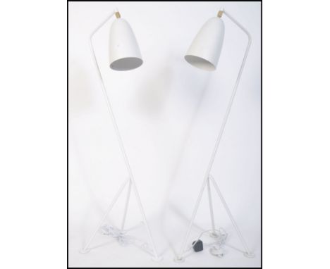 After Greta Grossman, a fabulous pair of large white grasshopper floor lamps. Having a tubular steel tripod frame with tilt a