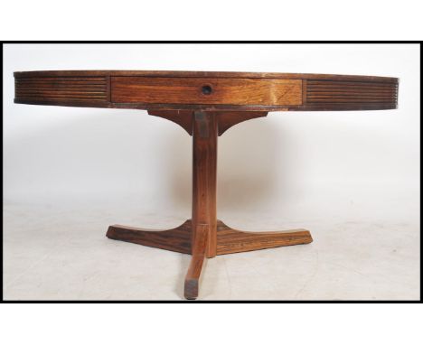 A mid century retro Robert Heritage for Archie Shine large drum shaped dining table. The round top with four frieze drawers i