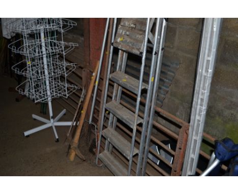 A keep net; a pick axe; a saw and various tools and an aluminium ladder 
