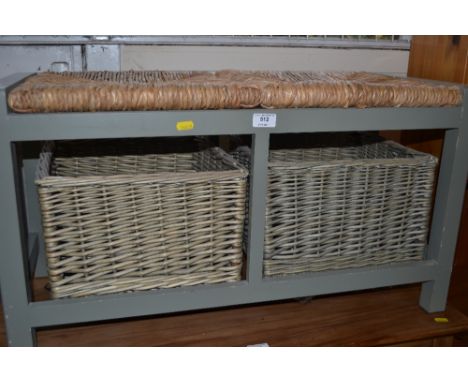 A grey painted and rush seated bench fitted with two wicker drawers 