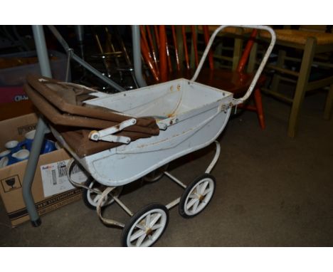 A metal doll's pram and a tin plate Chad Valley tambourine 